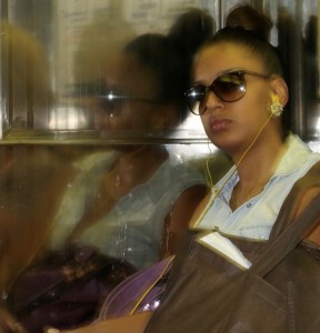 Woman reflecting on train 